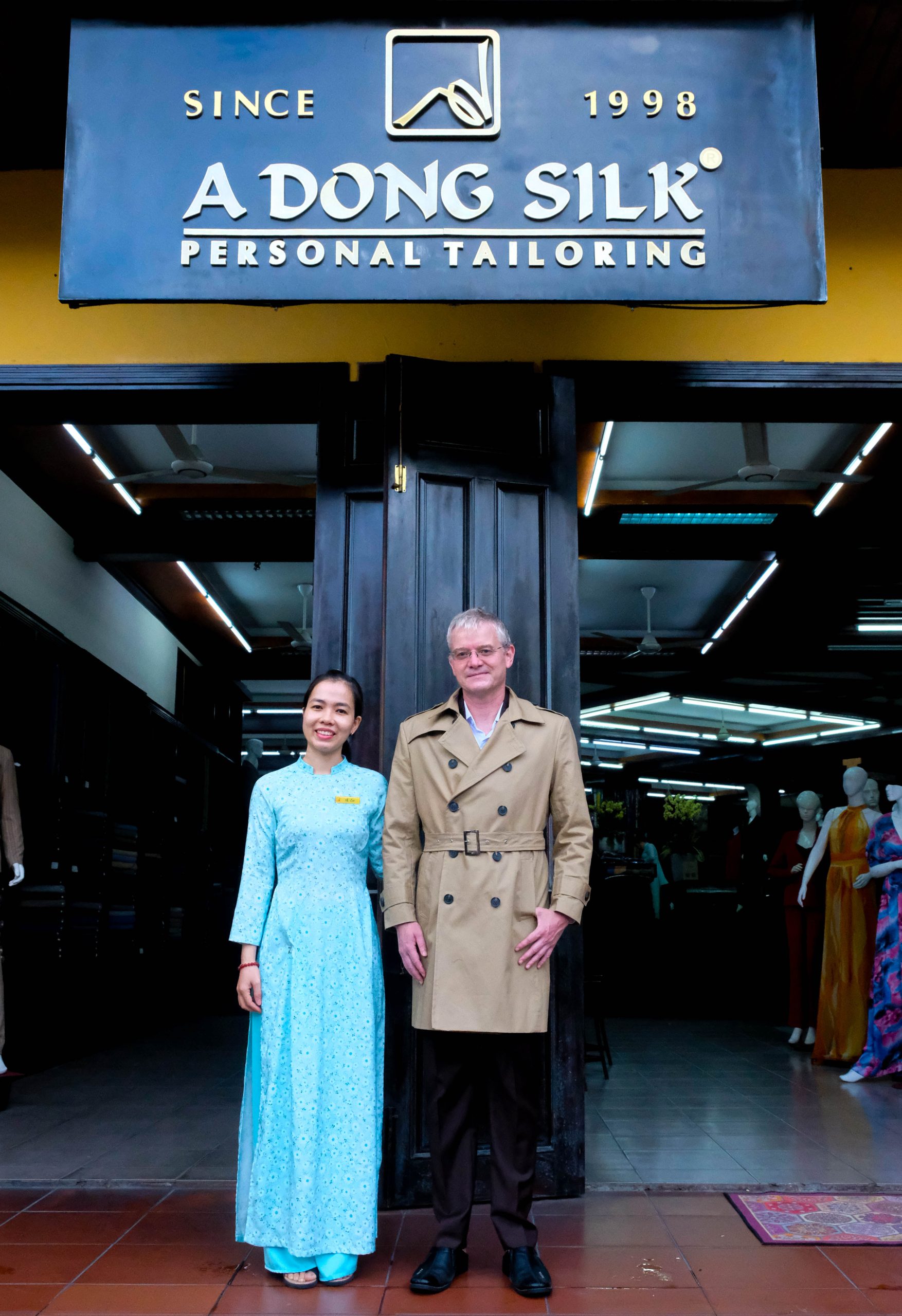 Customer in custom-made suit at A Dong Silk tailor Hoi An